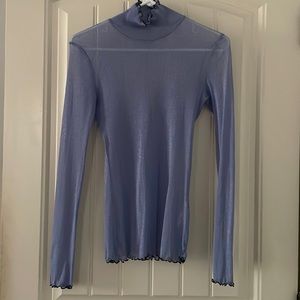 Purple fitted ‘see through’ blouse.